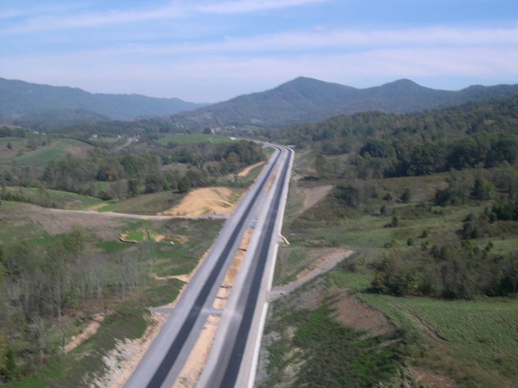 Divided interstate highway running through a mountain valley